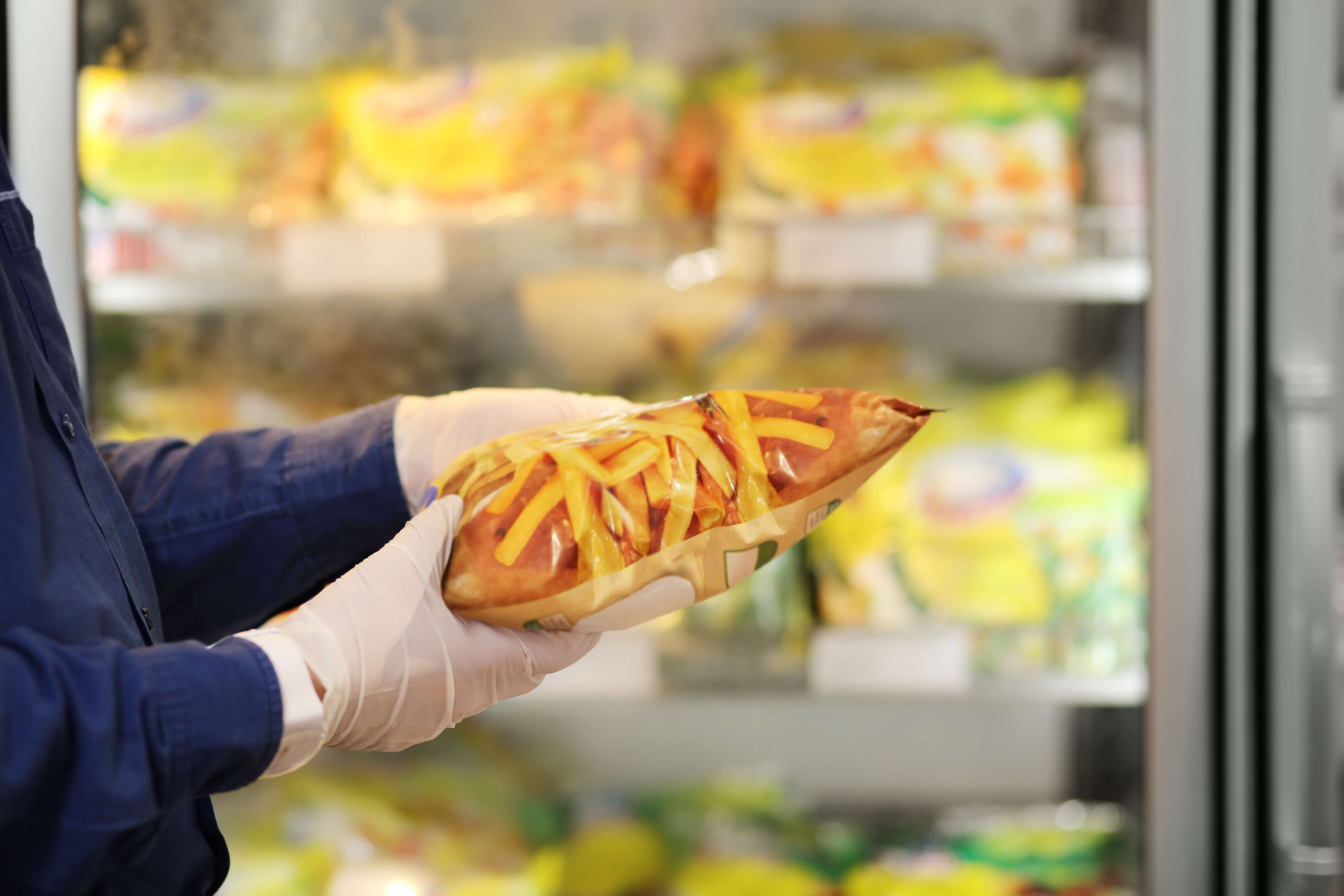 face mask and gloves,shopping in supermarket, reading product information,French fries